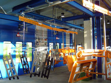 Overhead monorail system with painting cabin for the transport of components for the utility vehicle manufacturing